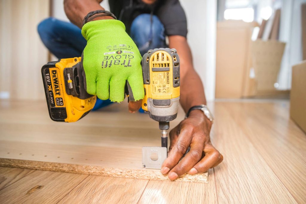 Technician Fixing Wood Floor Repair For Better Longevity